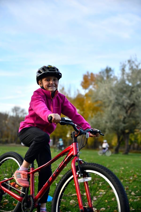 NICA Discovery rider smiling on a bike at their local program NICA Discovery rider smiling on a bike at their local program